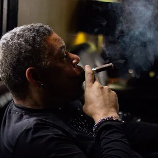 Mr. Kevin Holley smoking an Eiroa Azabache cigar.