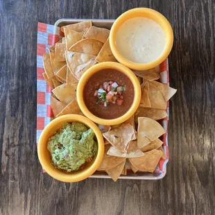 Dip trio with guacamole, salsa, and queso.  A tasty value!