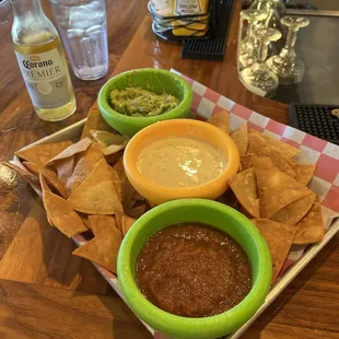 Dip trio with salsa, queso, and guacamole.