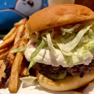 Burger on potato roll with goat cheese