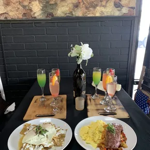 Chilaqulies and New York steak and eggs  Mimosa flight