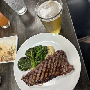 a steak, mashed potatoes, and broccoli