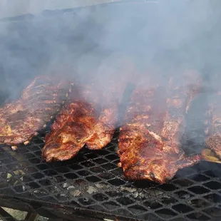 meat being cooked on a grill