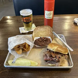 Pulled Pork Sandwich, Smoked Beans, Homemade Kettle Chips, Complimentary Texas Toast and Pickles and Lager! Yum!