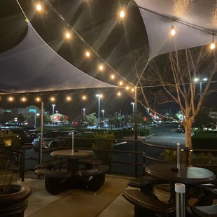 tables and chairs under a canopy