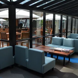 seating area with tables and chairs