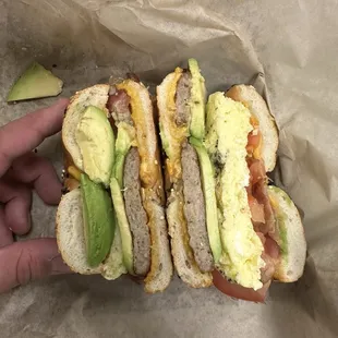 Egg Cheddar Sausage Breakfast Bagel with avocado