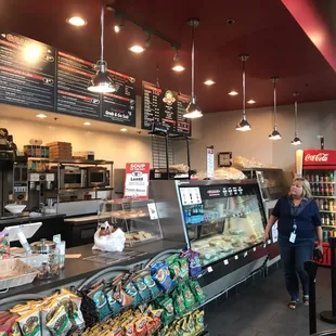 a woman standing in front of a counter