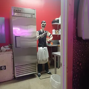 a man dressed as a zombie in a kitchen