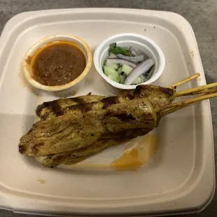 Chicken kebabs with peanut sauce and pickled veggies