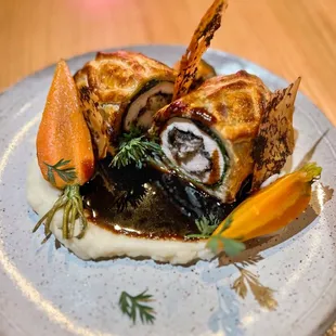 Truffle Chicken en Croute, perigord black truffle, pomme purée, spring thumbelina carrots, roasted chicken jus, truffle skin crisp