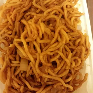 a plate of noodles with a spoon