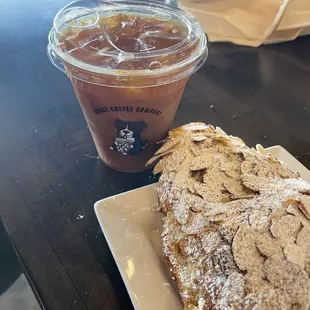 Iced Americano coffee with a splash of almond milk.