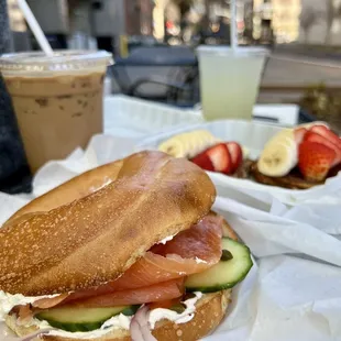 a bagel sandwich and a drink