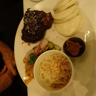 Duroc Pork Shank - Korean chili glaze, XO sauce, kimchi, steamed bao buns and glass noodle salad