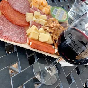 Meat and cheese tray with Crimson wine