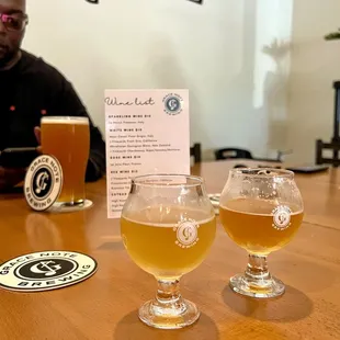 three glasses of beer on a table