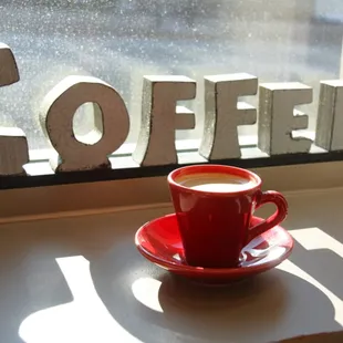 a cup of coffee on a saucer