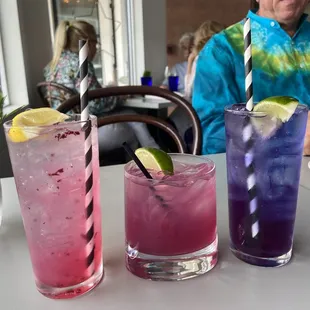 three different drinks on a table