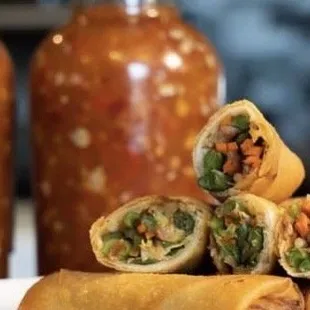 a plate of vegetable spring rolls