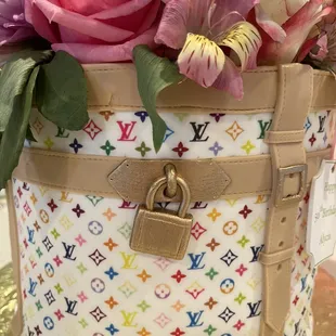 a multicolored louis vuitton bag