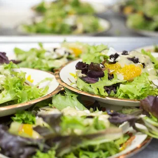 We have a variety of fresh salads, often featuring fresh produce donations.