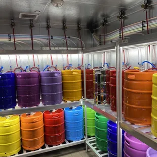 a row of colorful barrels in a commercial kitchen