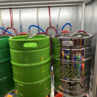 several kegs in a refrigerator