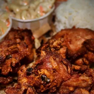 a plate of fried chicken and rice