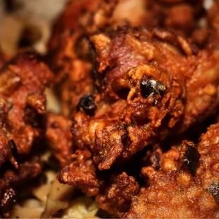 a plate of fried chicken wings