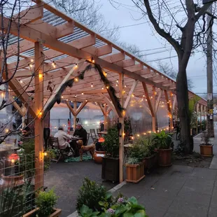 Introducing our new permanent patio structure! Complete with rain flaps, heaters, and lighting. Welcome to our new &amp; improved jungle patio!