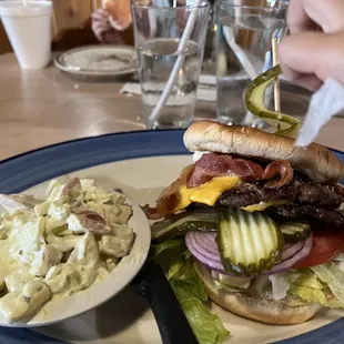 Double bacon cheeseburger with potato salad
