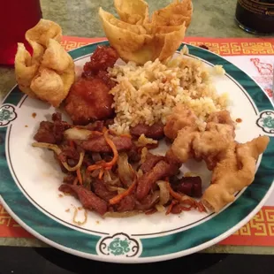 Crab Rangoon, sweet and sour pork, fried rice and the Gracie&apos;s special pork chop!!