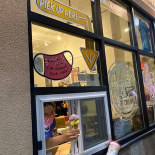 a woman opening a window