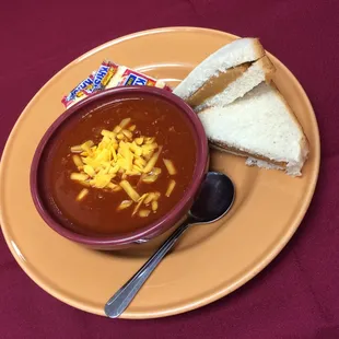 a bowl of soup and a slice of bread