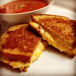 a grilled cheese sandwich with tomato soup