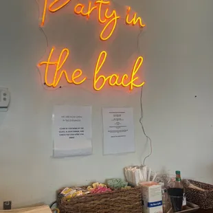 a neon sign that says party in the back