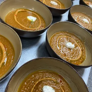 Carrot ginger soup, romesco, crema