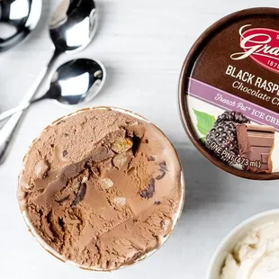 a bowl of ice cream and spoons