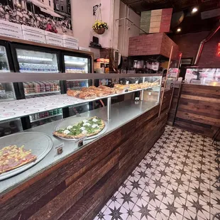 pizzas on display in a restaurant