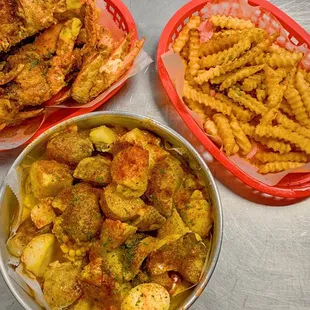 three bowls of fried food on a table