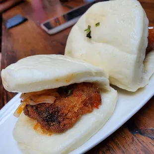 two buns on a white plate