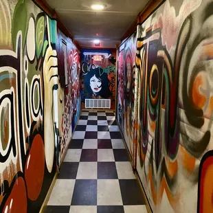 Cool painted hallway to bathrooms!
