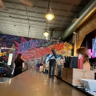 a woman behind the bar