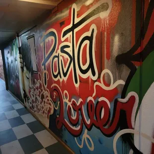 Graffiti hallway to restrooms
