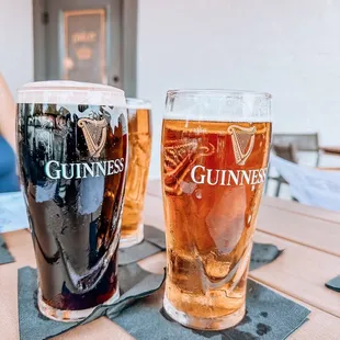 two pints of beer on a table