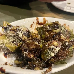 a plate of brussel sprouts on a table