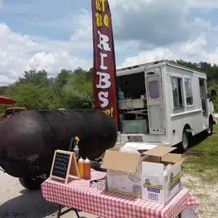 a bbq truck and a cow