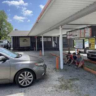 The store front and they do clip the tray onto the car if that&apos;s what or want. Or there is picnic tables.