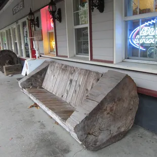 A neat bench made out of a huge log.